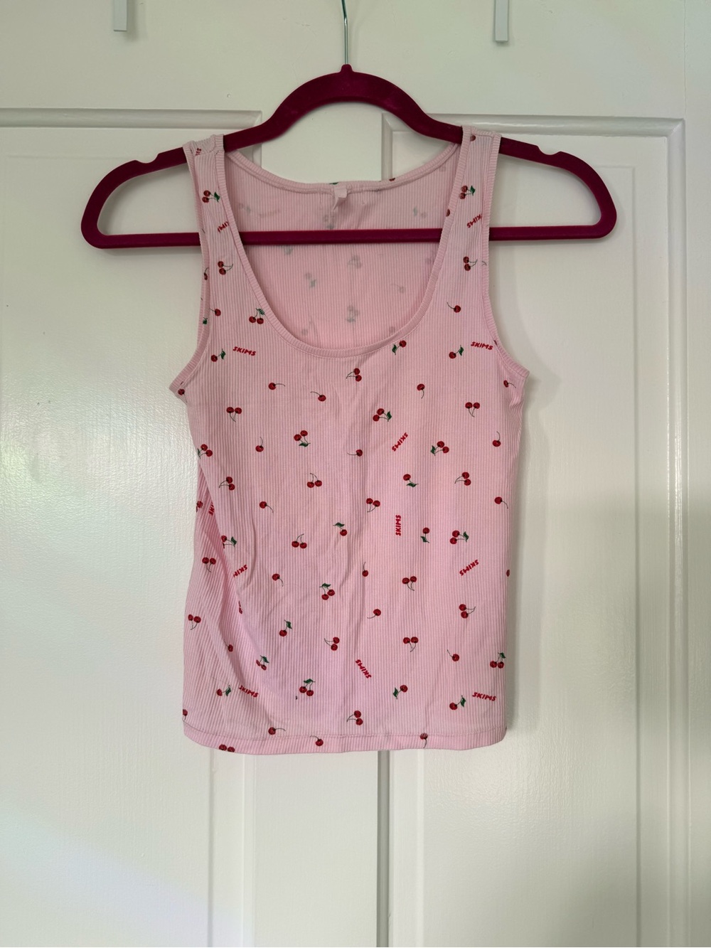 Skims soft lounge tank in cherry blossom with cherries and skims logo pattern